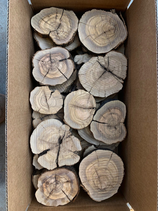 Box filled with olive wood slices for sale