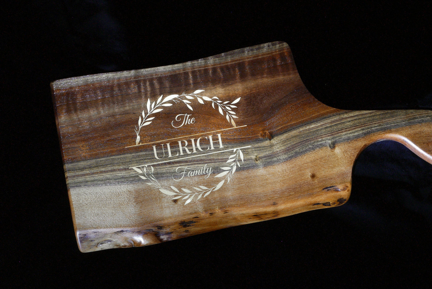 Live edge wooden cutting board with a Maple wood inlay